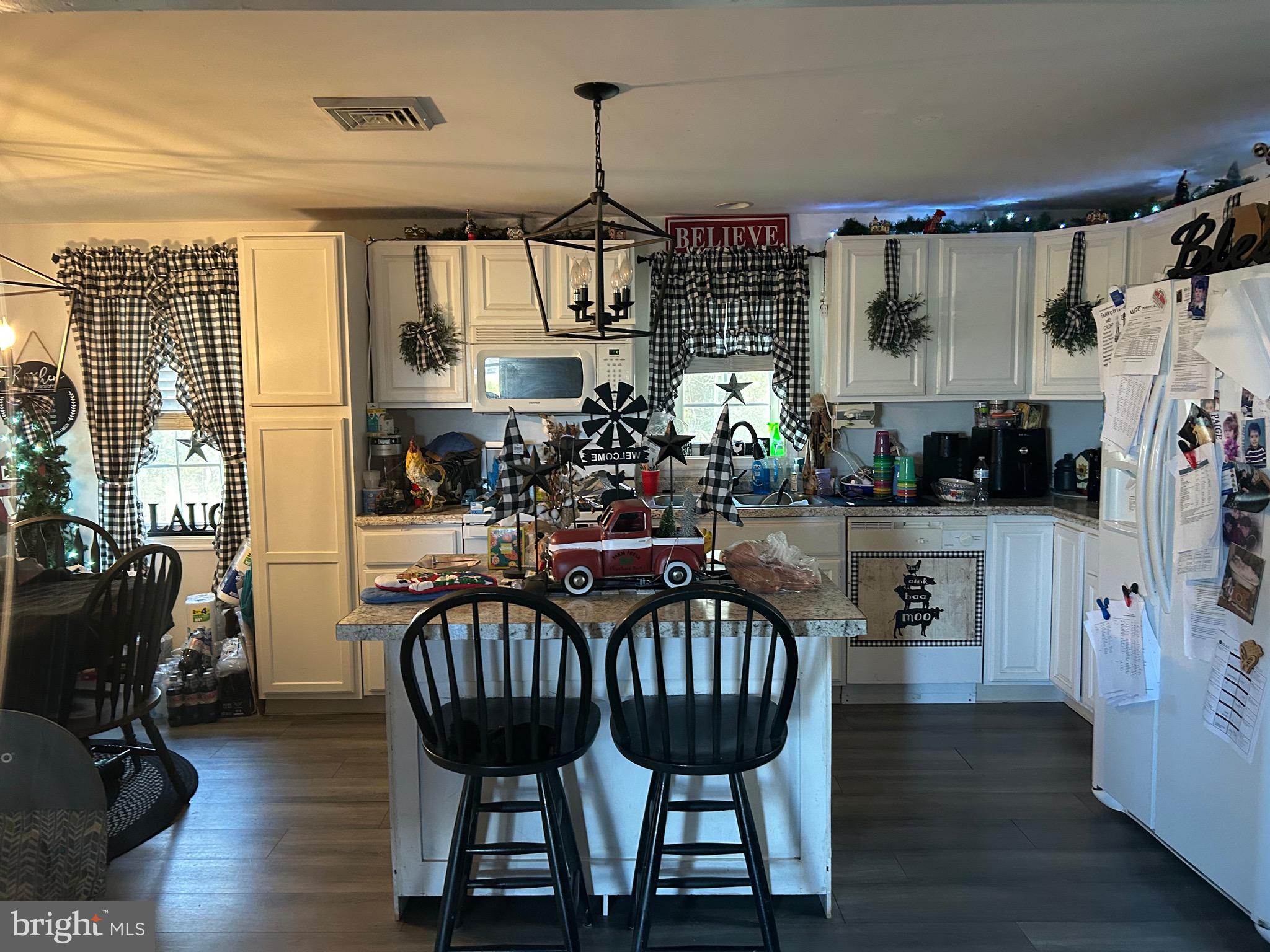 30423 Baynard Road Trappe, MD 21673 - Photo 15 of 25 a view of a dining room with furniture window and wooden floor