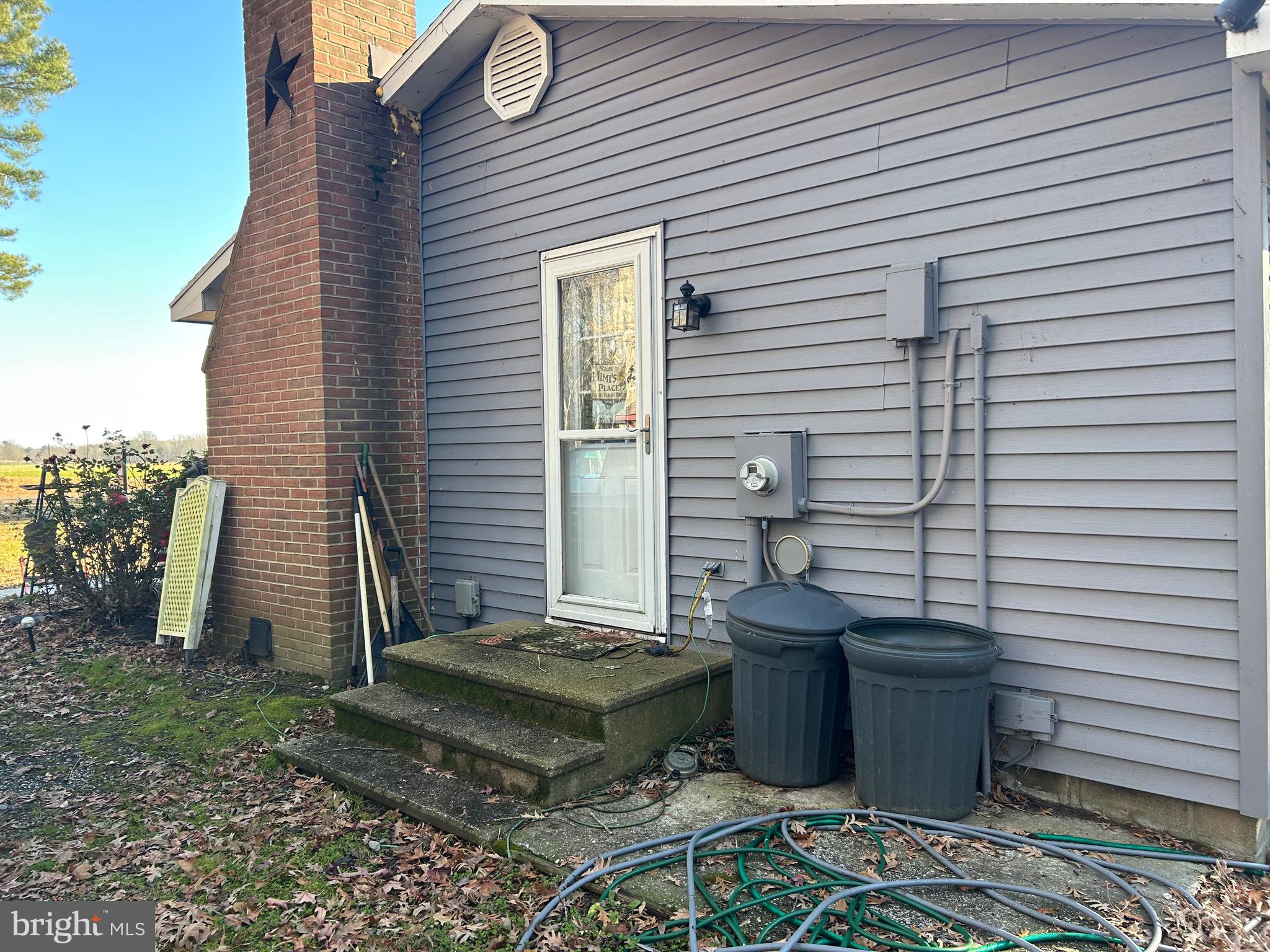30423 Baynard Road Trappe, MD 21673 - Photo 10 of 25 a view of a patio with table and chairs with wooden fence