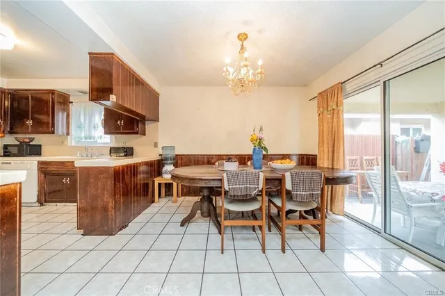 a kitchen with a sink a stove and a refrigerator