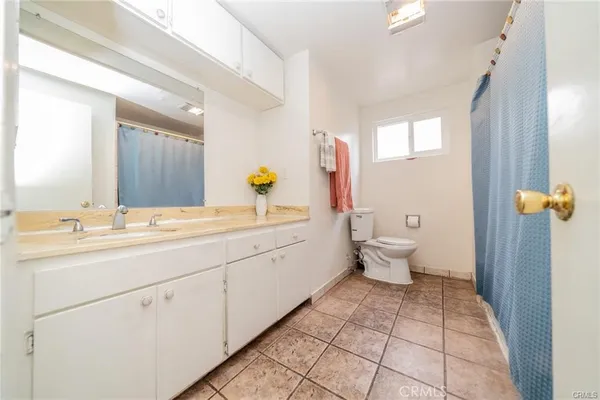 a room with a bed and furniture