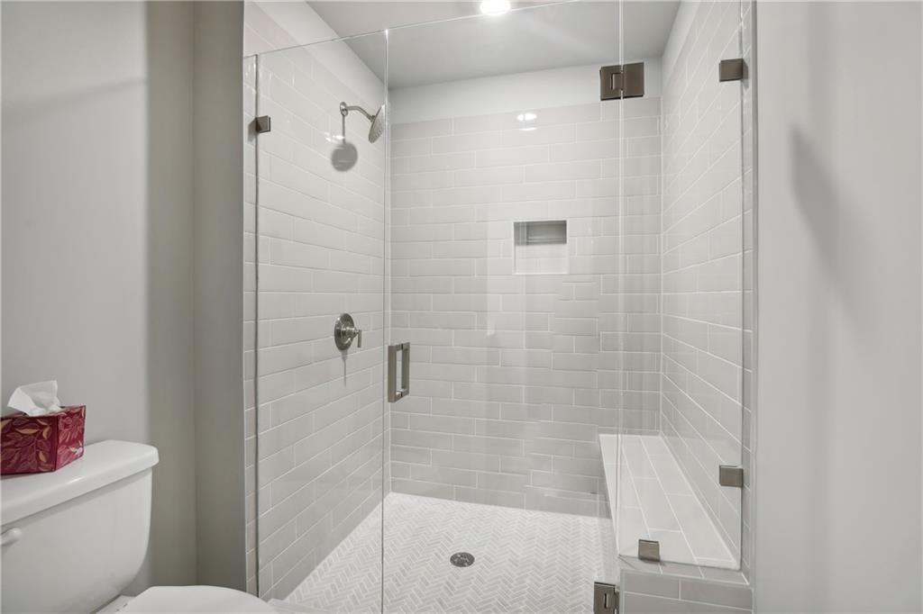 911 East Green Lane Clarkston, GA 30021 - Photo 22 of 43 a bathroom with a shower and a toilet