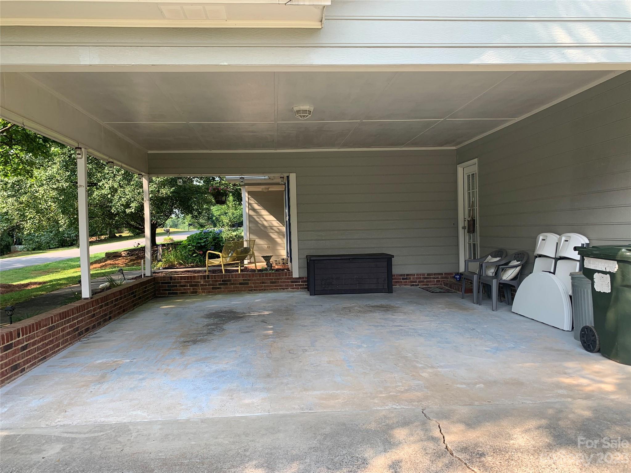 402 Split Oak Trail Gastonia, NC 28052 - Photo 11 of 23 a view of a porch with furniture and floor to ceiling window