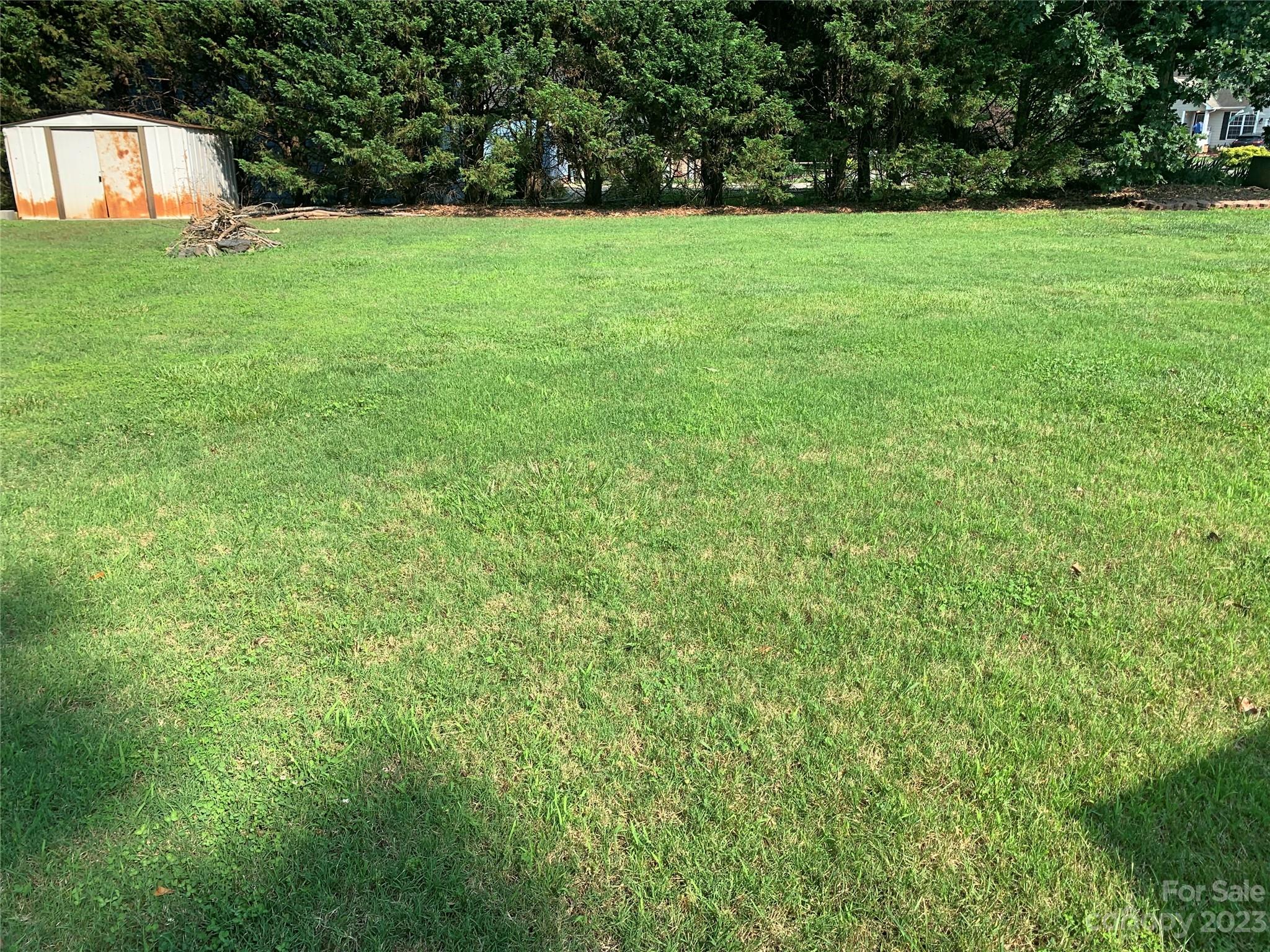 402 Split Oak Trail Gastonia, NC 28052 - Photo 14 of 23 a view of a grassy field with trees