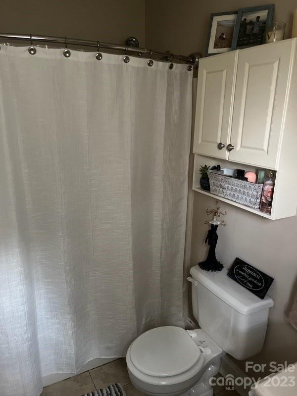 402 Split Oak Trail Gastonia, NC 28052 - Photo 20 of 23 a white toilet sitting next to a sink