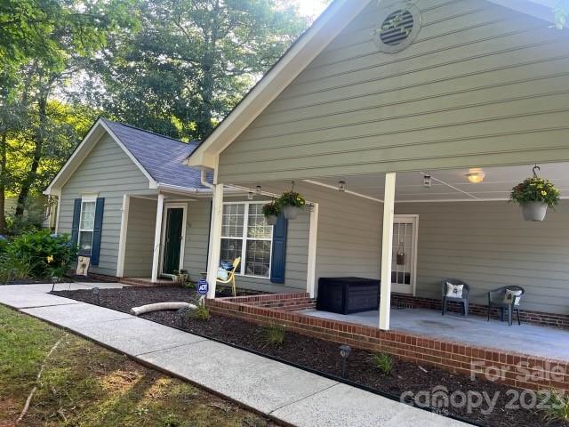402 Split Oak Trail Gastonia, NC 28052 - Photo 2 of 23 a front view of house with yard outdoor seating and barbeque oven