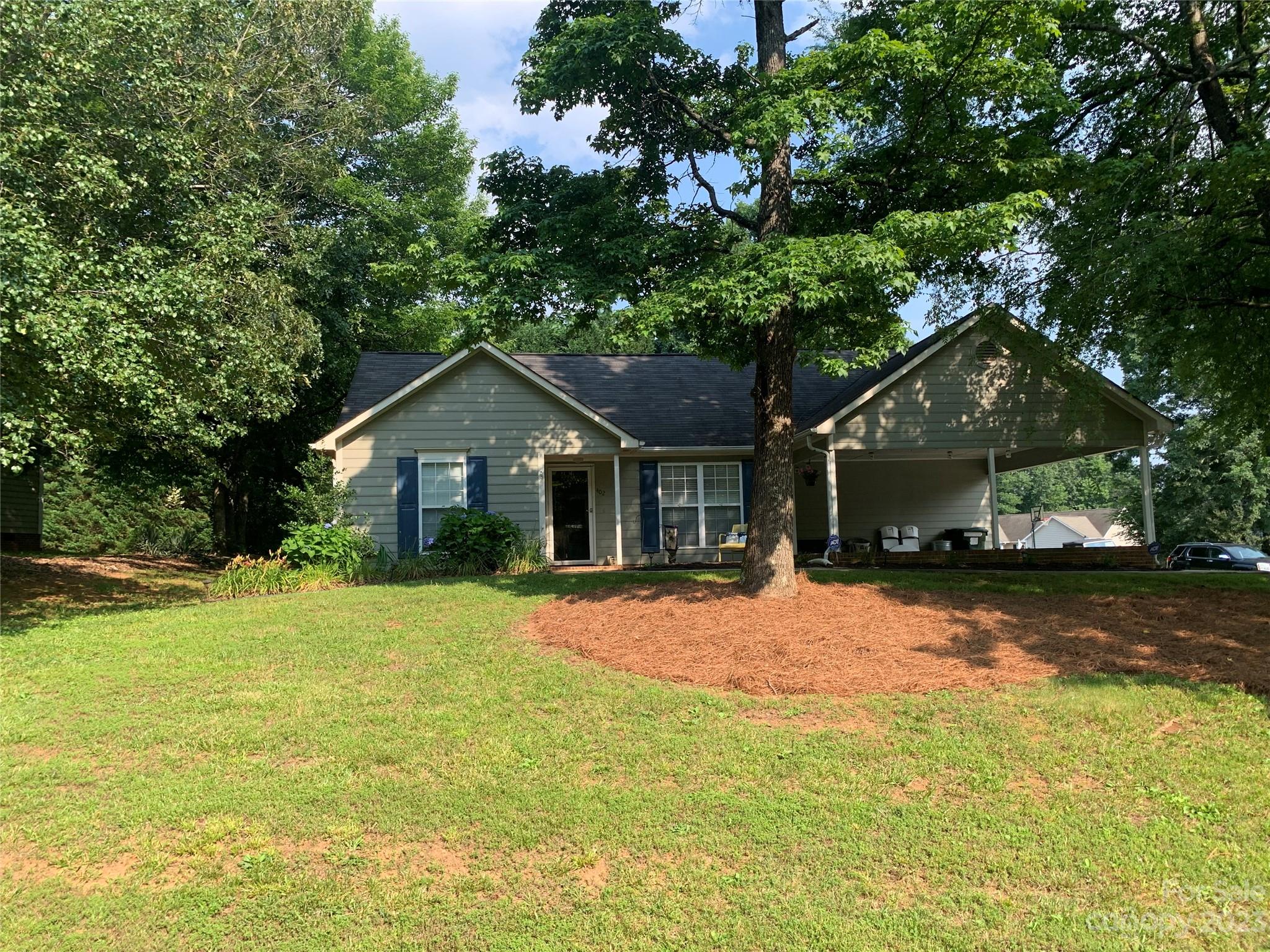 402 Split Oak Trail Gastonia, NC 28052 - Photo 3 of 23 a front view of a house with a yard and trees