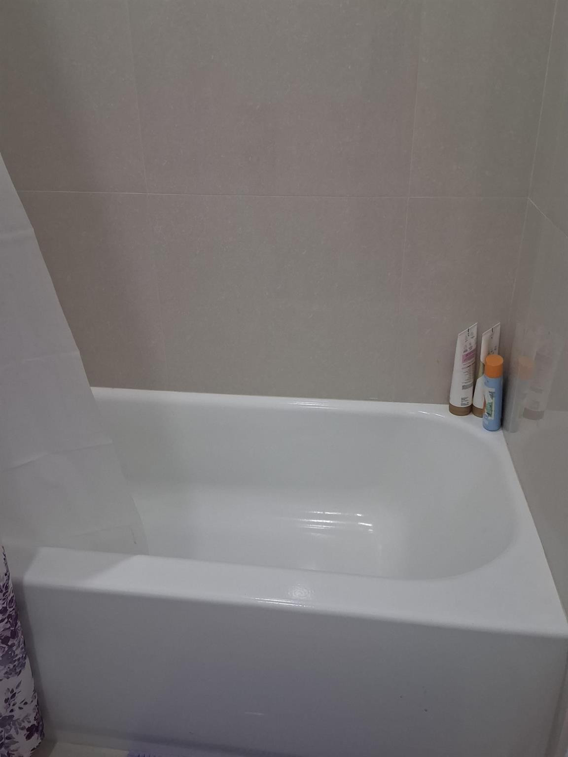 338 Southwest 15th Street, Unit 338 Dania Beach, FL 33004 - Photo 12 of 14 a close up of a bathtub