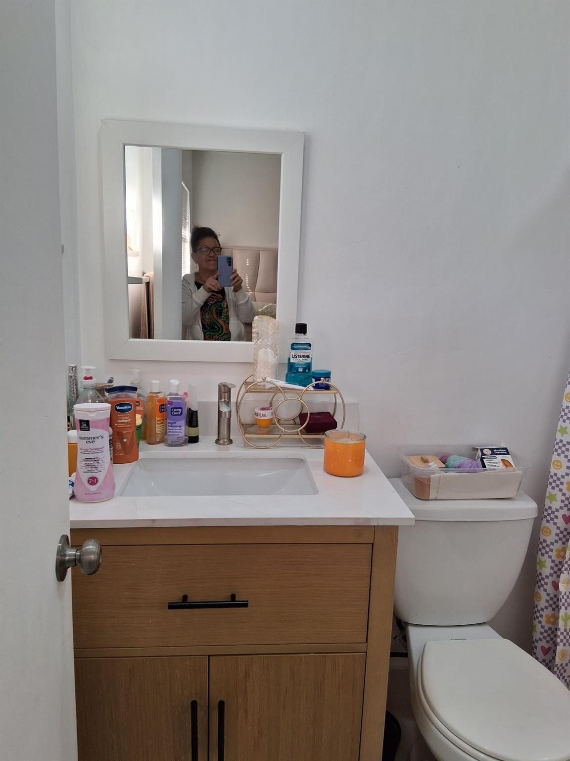 338 Southwest 15th Street, Unit 338 Dania Beach, FL 33004 - Photo 5 of 14 a bathroom with a sink toilet vanity and mirror