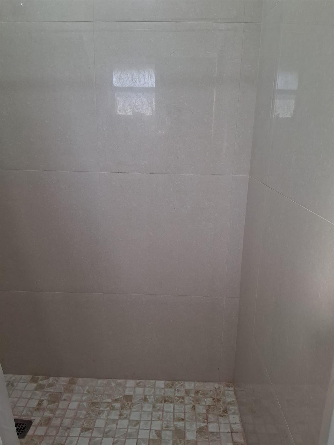 338 Southwest 15th Street, Unit 338 Dania Beach, FL 33004 - Photo 7 of 14 a bathroom with a window