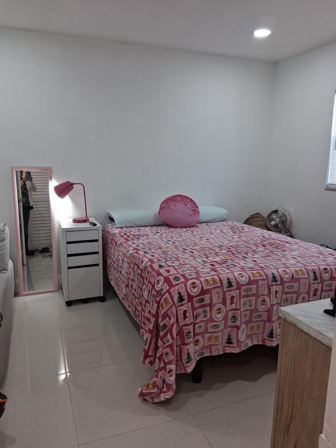 338 Southwest 15th Street, Unit 338 Dania Beach, FL 33004 - Photo 8 of 14 a bedroom with a bed and a window