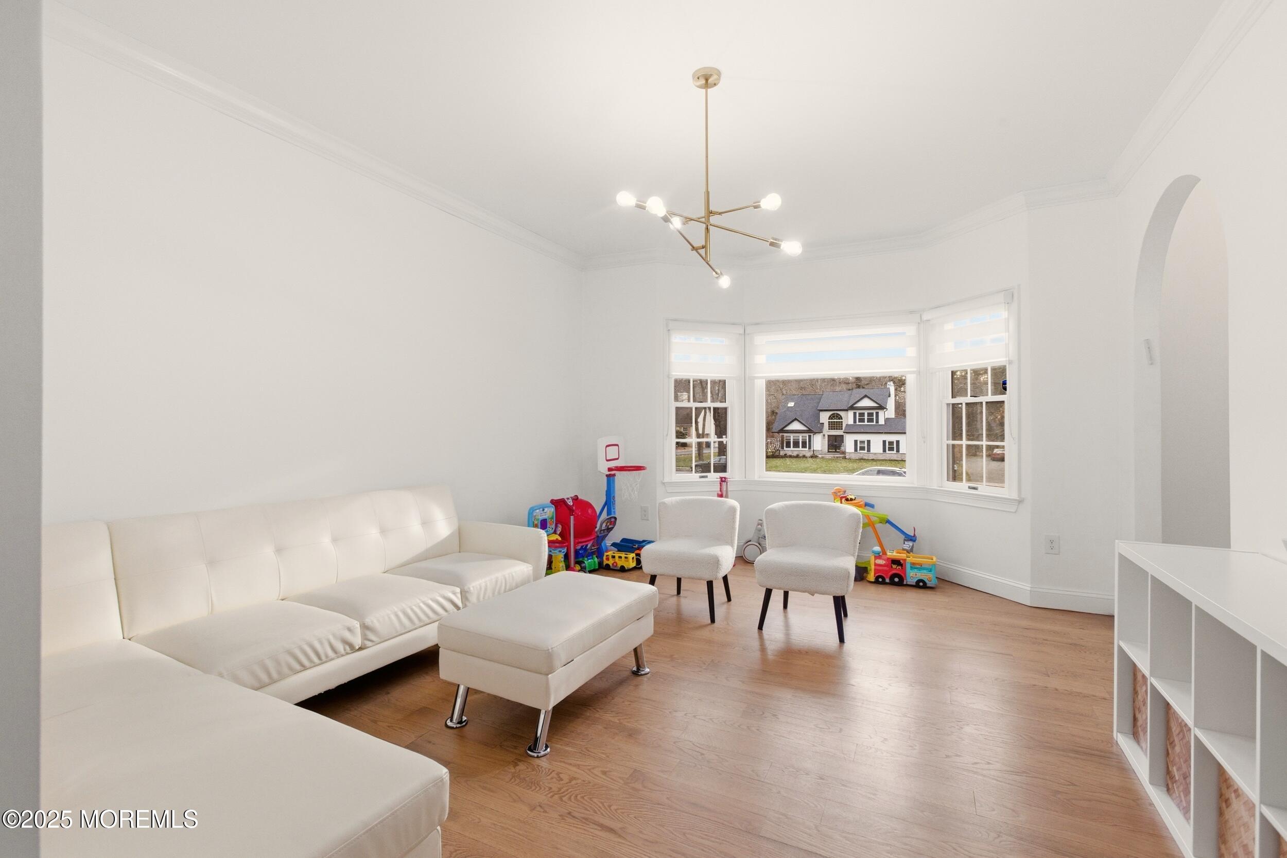 5 Overlook Drive Jackson, NJ 08527 - Photo 12 of 56 a living room with furniture and a chandelier