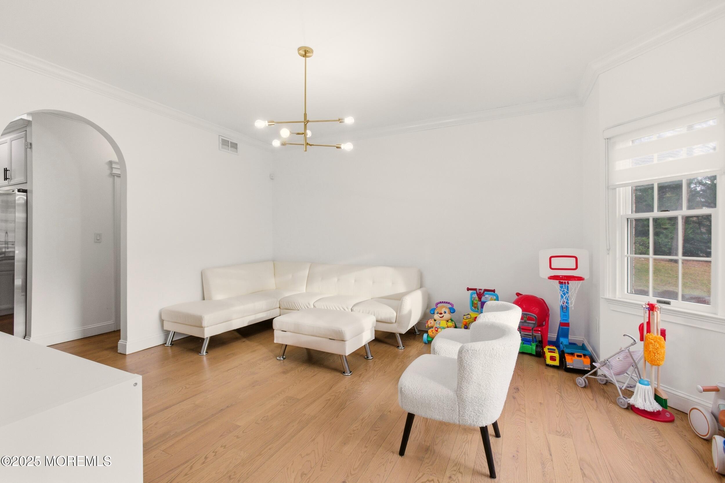 5 Overlook Drive Jackson, NJ 08527 - Photo 13 of 56 a living room with furniture and a wooden floor