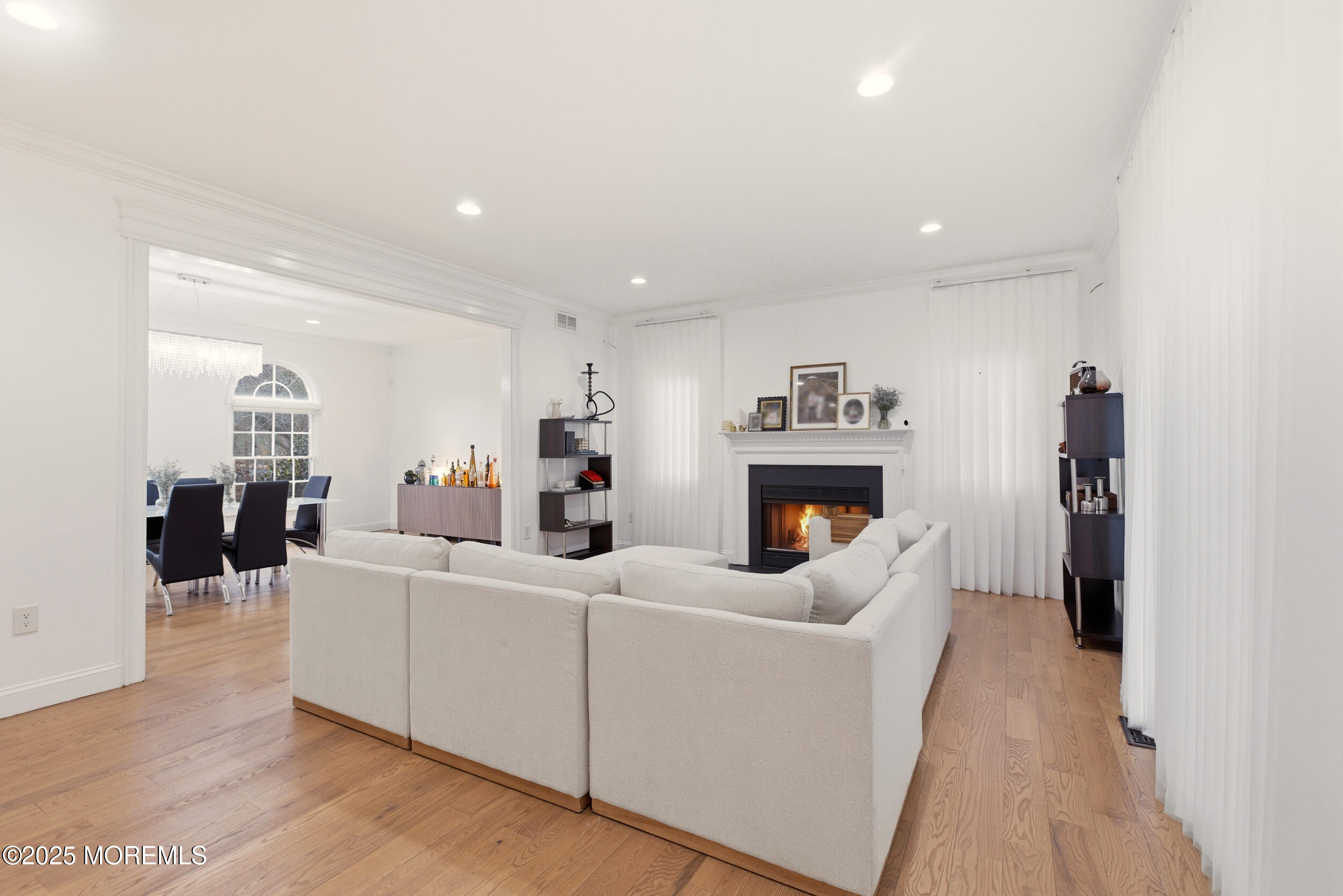 5 Overlook Drive Jackson, NJ 08527 - Photo 14 of 56 a living room with furniture a fireplace and a flat screen tv