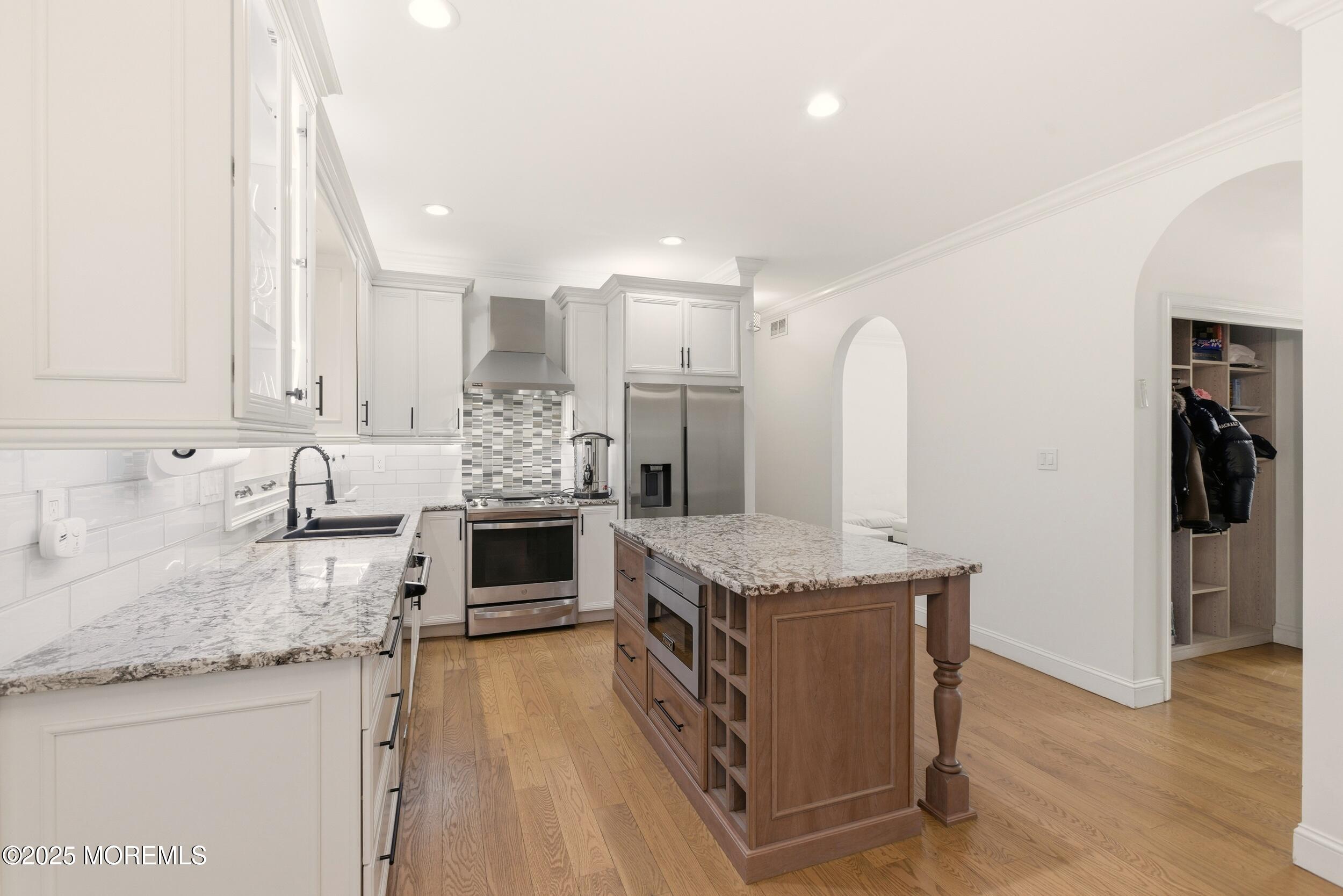 5 Overlook Drive Jackson, NJ 08527 - Photo 18 of 56 a kitchen with stainless steel appliances granite countertop a stove top oven and sink