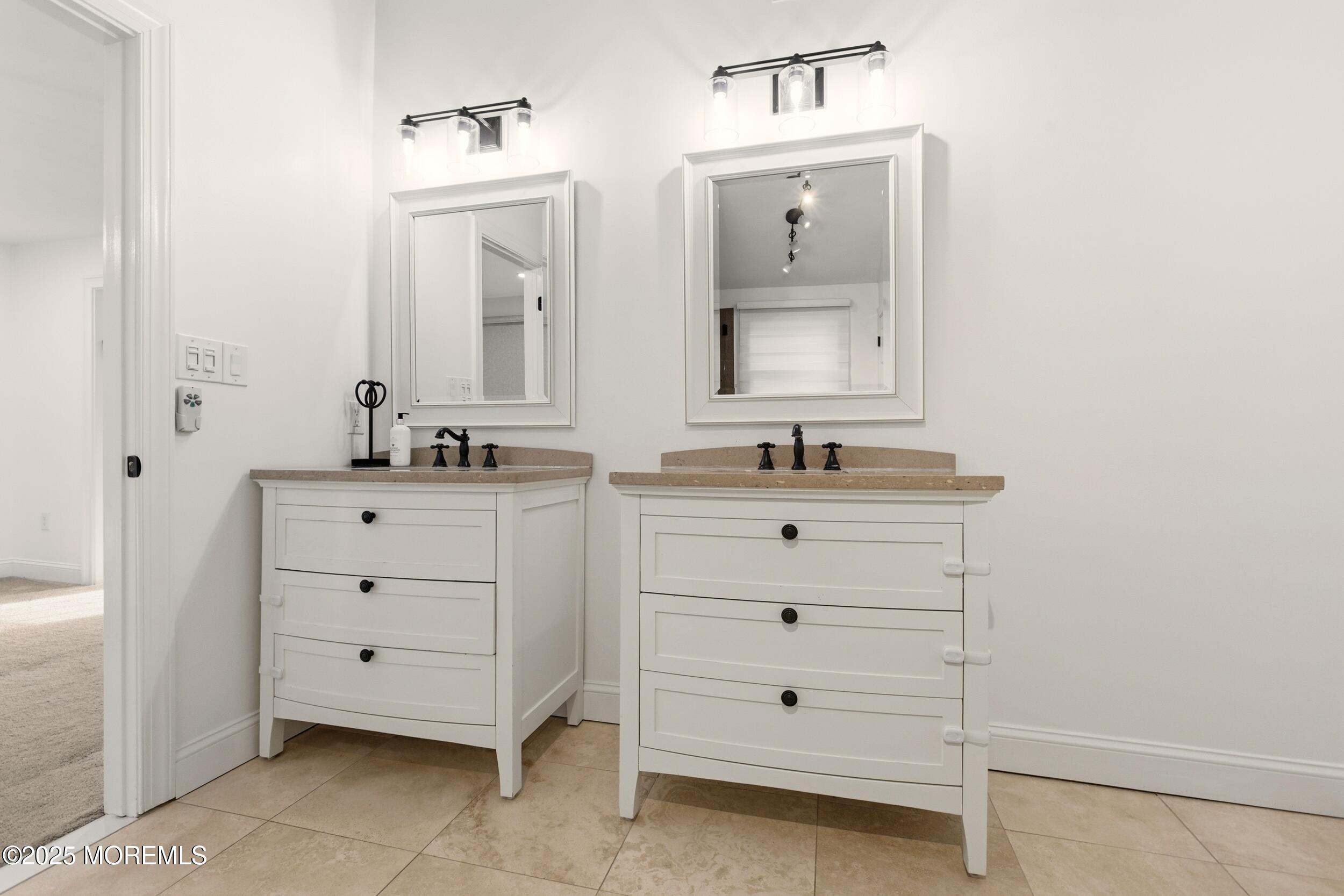 5 Overlook Drive Jackson, NJ 08527 - Photo 31 of 56 a bathroom with a sink vanity and mirror