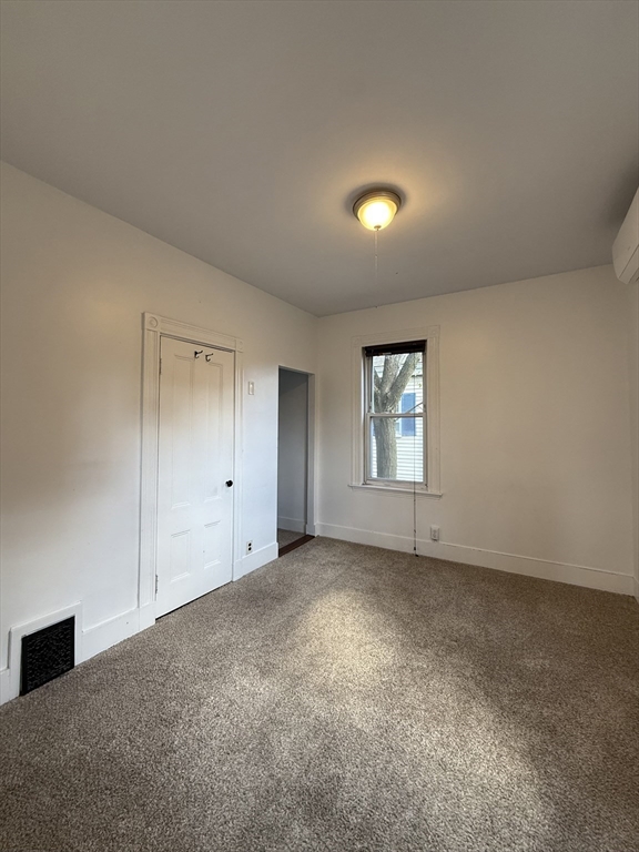 32-34 Etna Street, Unit 2 Boston, MA 02135 - Photo 10 of 12 an empty room with windows and closet