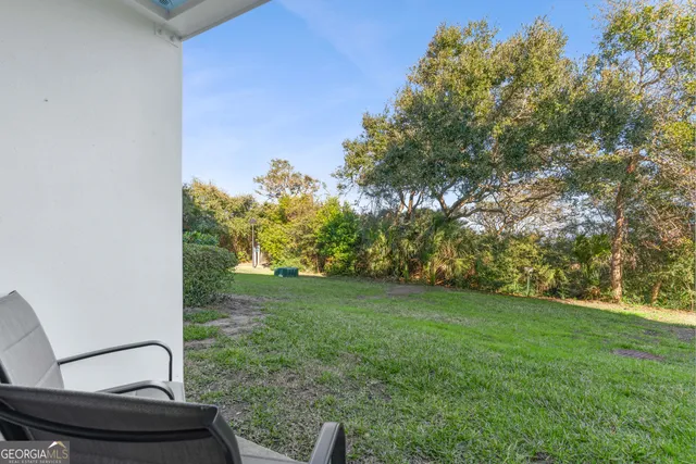 a view of a back yard from a patio