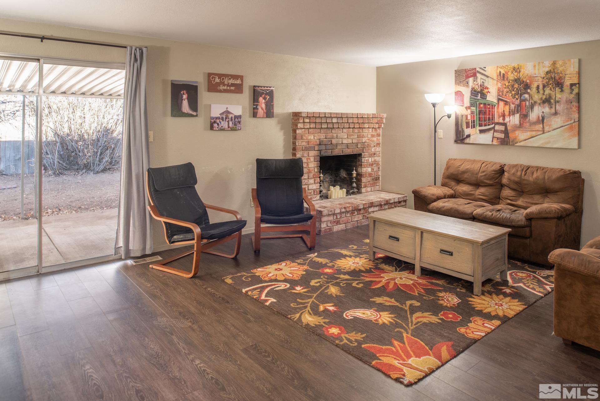 2995 Bobby Drive Reno, NV 89502 - Photo 3 of 17 a living room with furniture and a fireplace