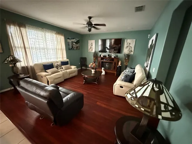 a living room with furniture and a large window