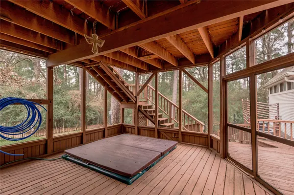 a view of outdoor space with wooden floor and iron stairs