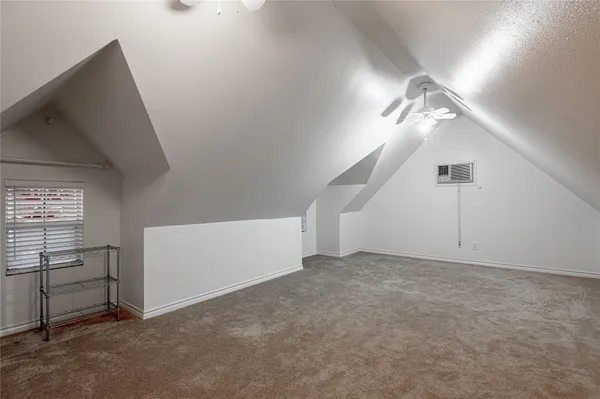 a view of an empty room with windows