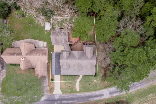 an aerial view of residential house with outdoor space