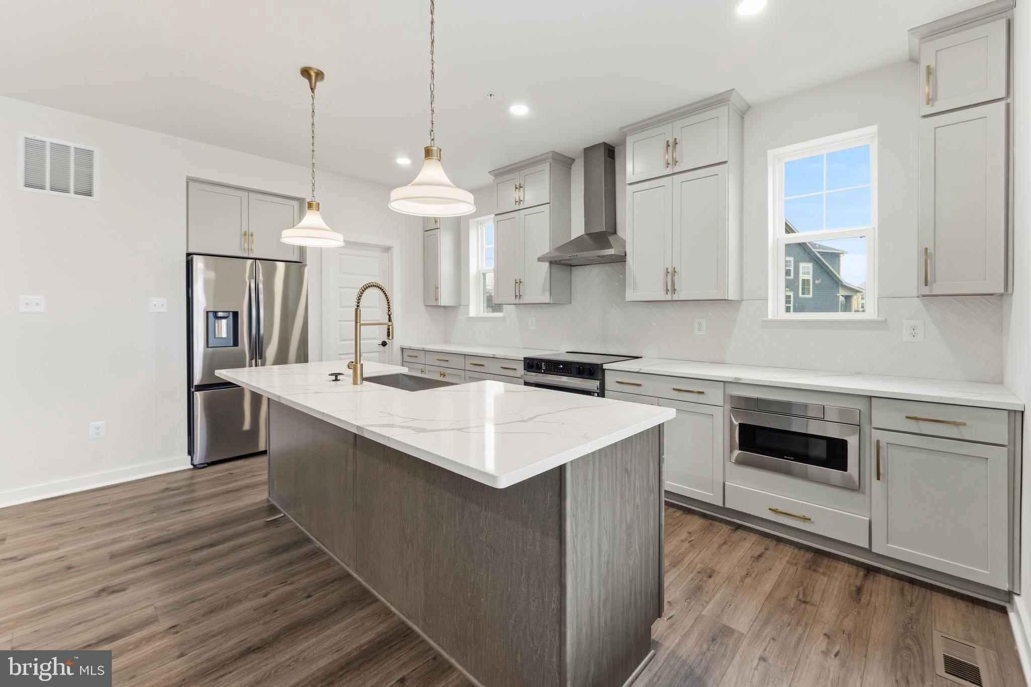 19110 Tatie Way Poolesville, MD 20837 - Photo 4 of 29 a kitchen with a sink stainless steel appliances a counter space and a window