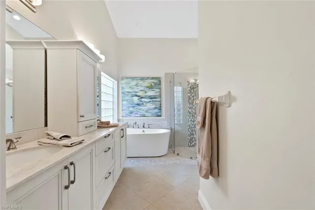 a bed room with two bed and a chandelier