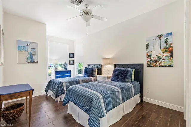 a spacious bedroom with a bed and a couch