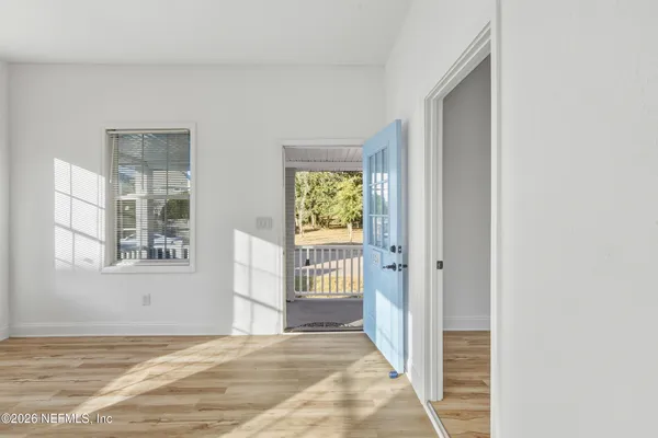 a view of an empty room with a window