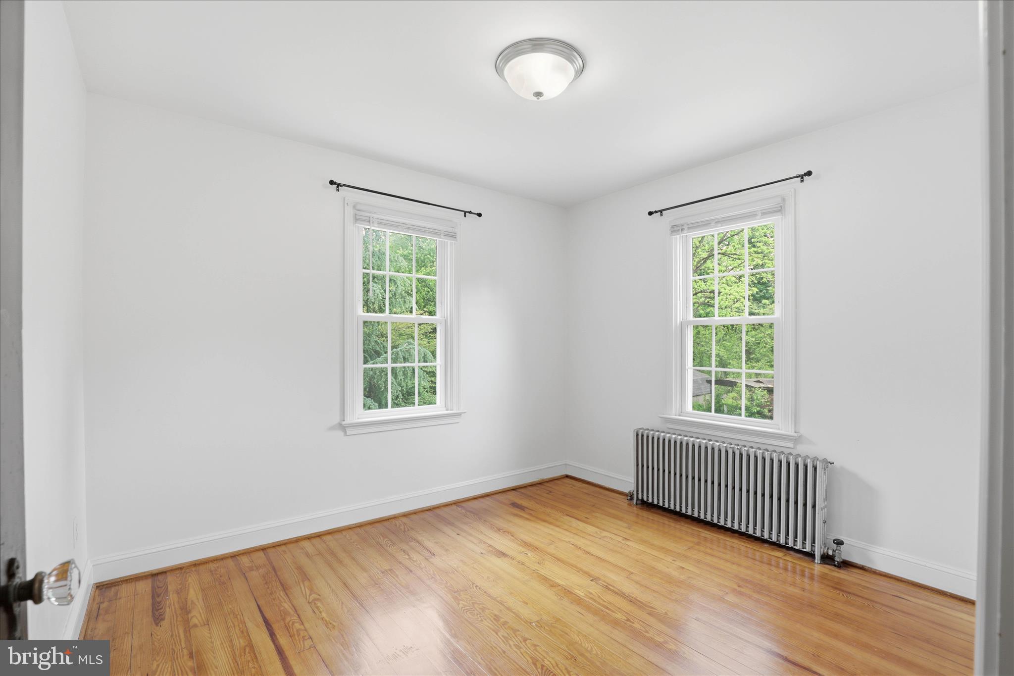 169 School House Road Lancaster, PA 17603 - Photo 21 of 39 an empty room with wooden floor and windows