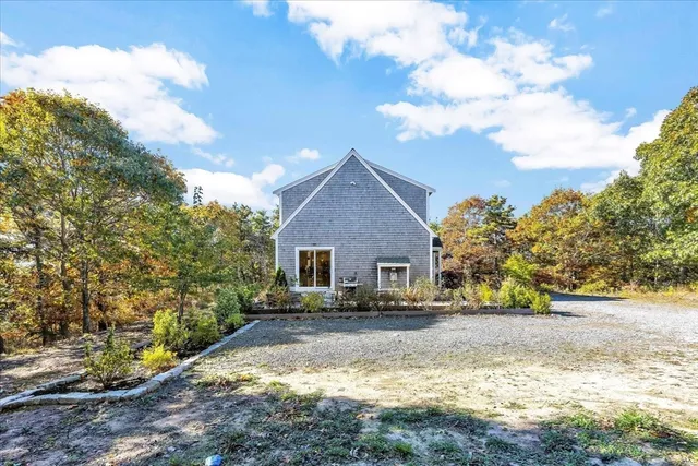 a view of house with yard