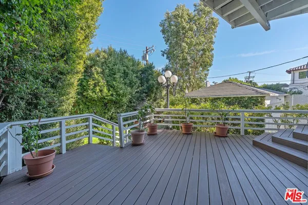 a view of balcony with deck and wooden floor