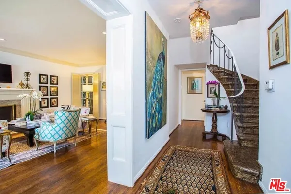 a view of entryway with wooden floor