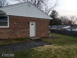 40 Sharon Avenue Edison, NJ 08817 - Photo 2 of 15 a front view of a house with a yard