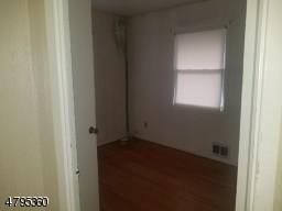 40 Sharon Avenue Edison, NJ 08817 - Photo 3 of 15 a view of an empty room and a window