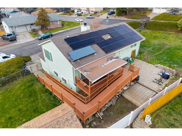 an aerial view of a house with a garden
