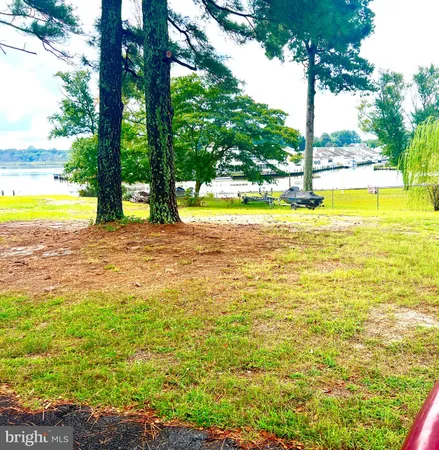 a view of a swimming pool with an outdoor space and seating area
