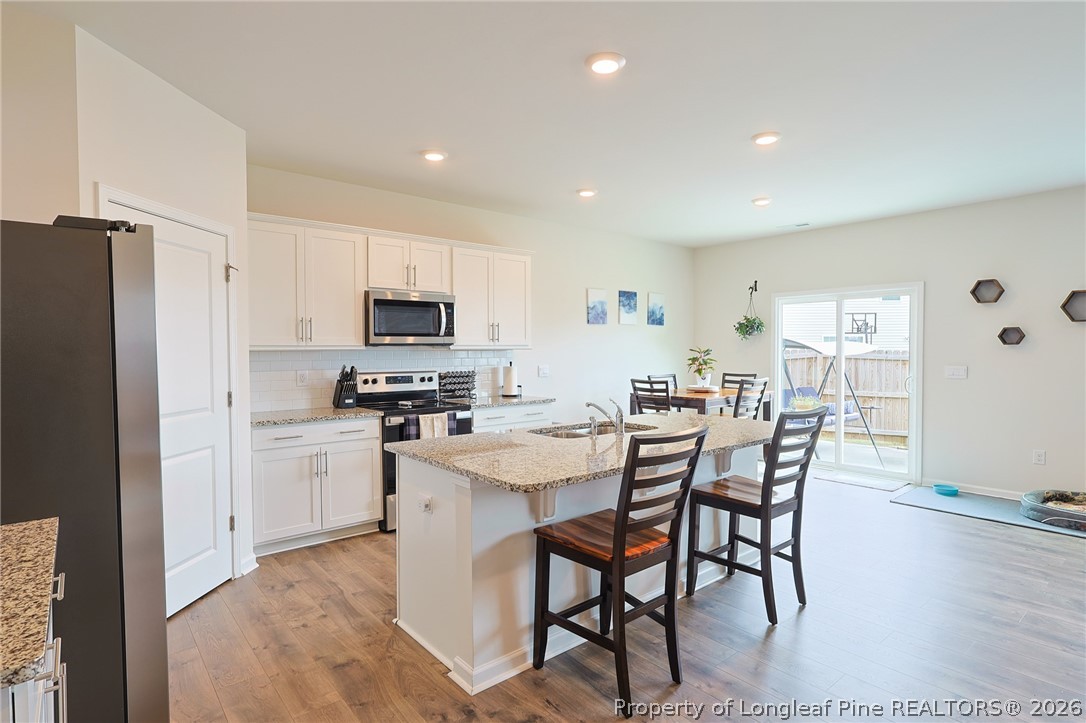 a kitchen with appliances cabinets and a counter top space