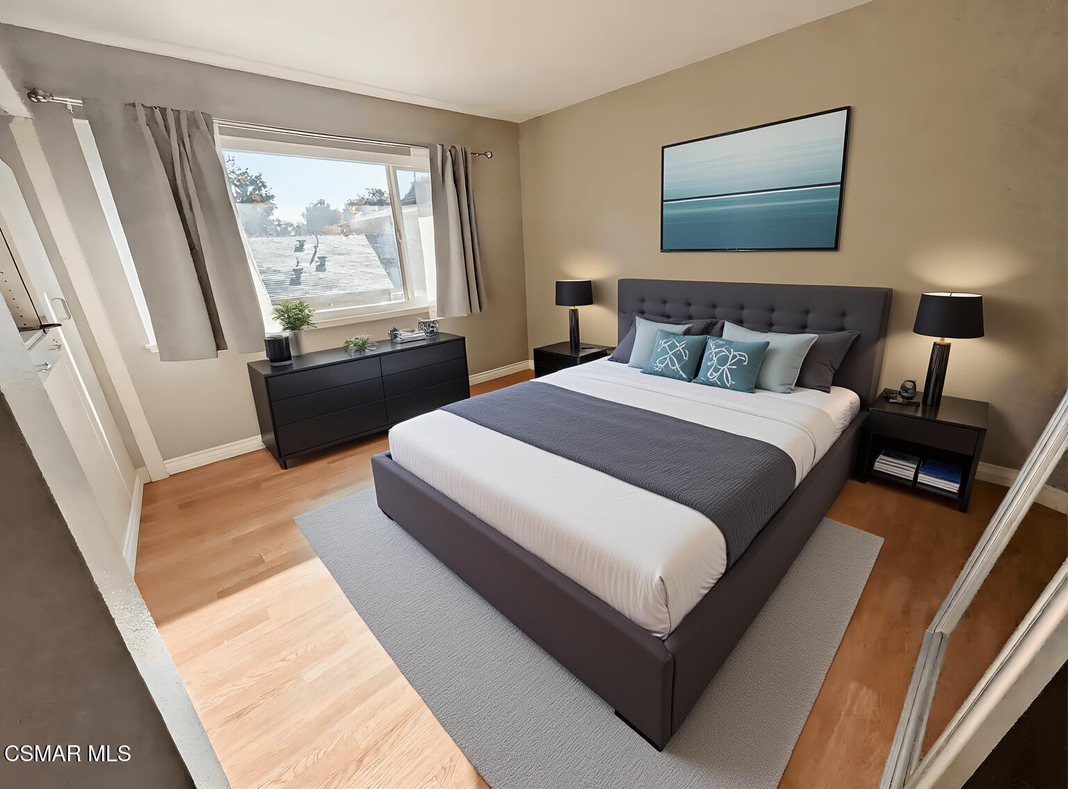 28713 Conejo View Drive Agoura Hills, CA 91301 - Photo 15 of 28 a bedroom with a bed and wooden floor