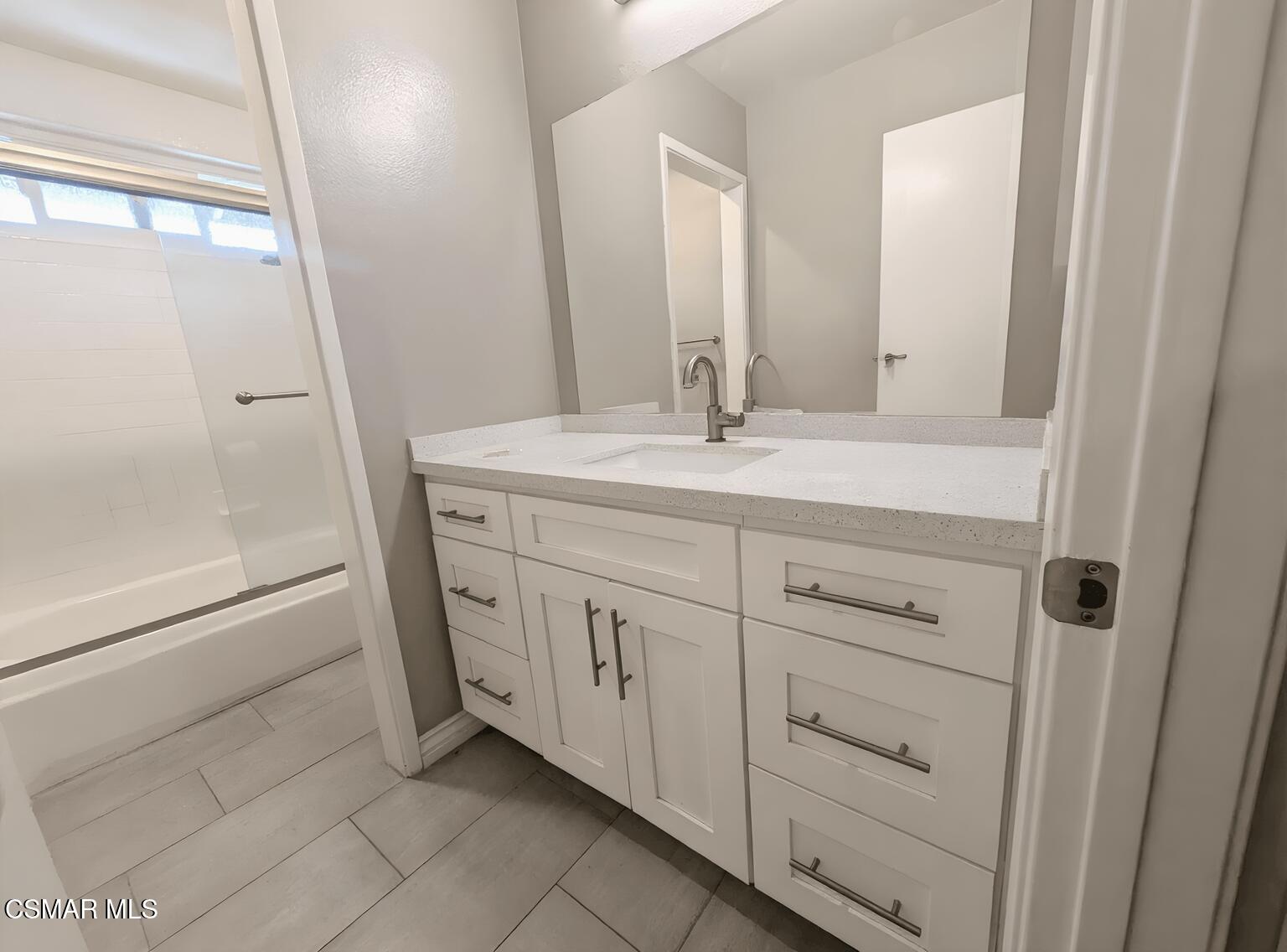 28713 Conejo View Drive Agoura Hills, CA 91301 - Photo 18 of 28 a bathroom with a double vanity sink and mirror