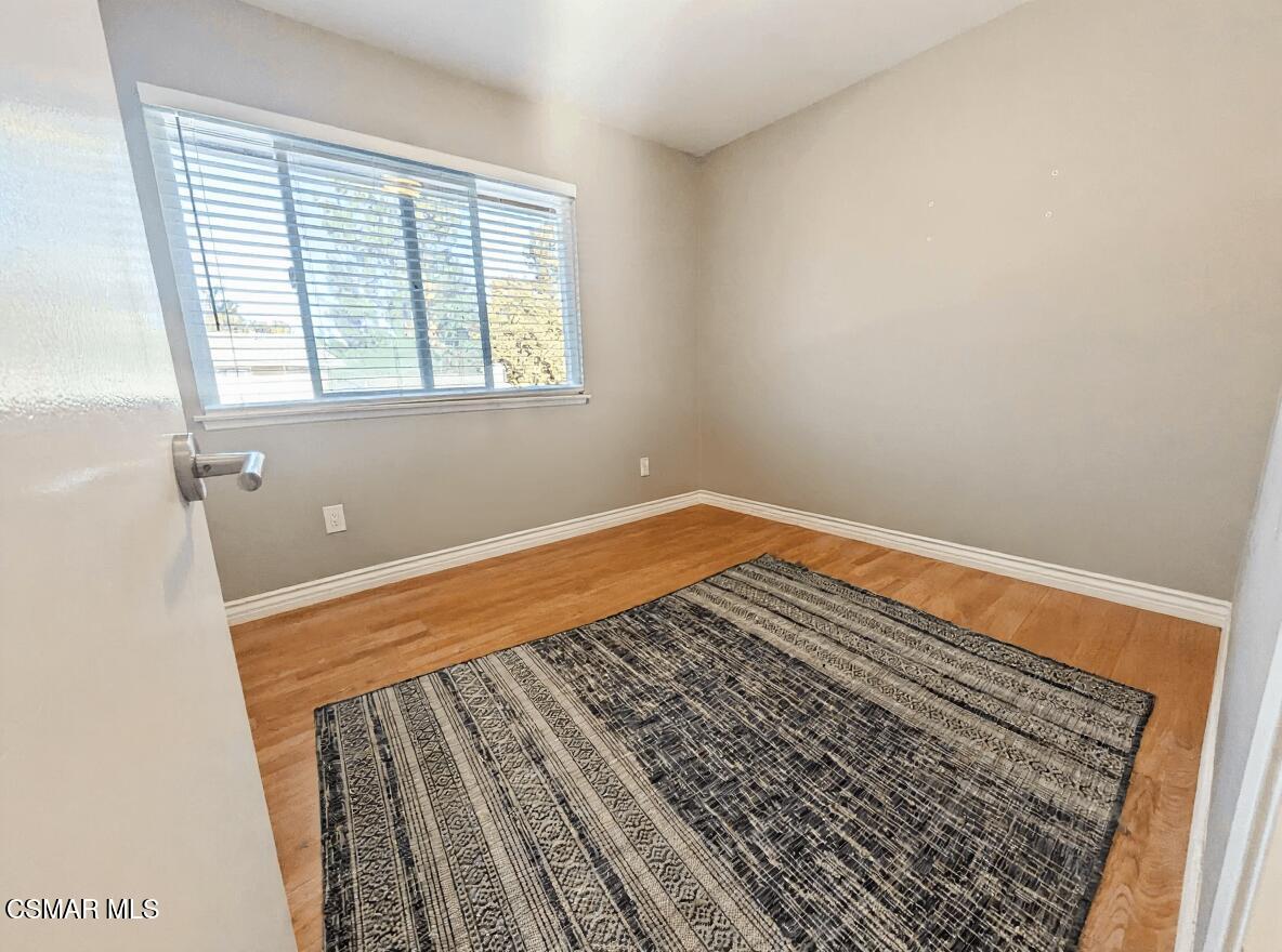 28713 Conejo View Drive Agoura Hills, CA 91301 - Photo 21 of 28 a view of a room with wooden floor and small window