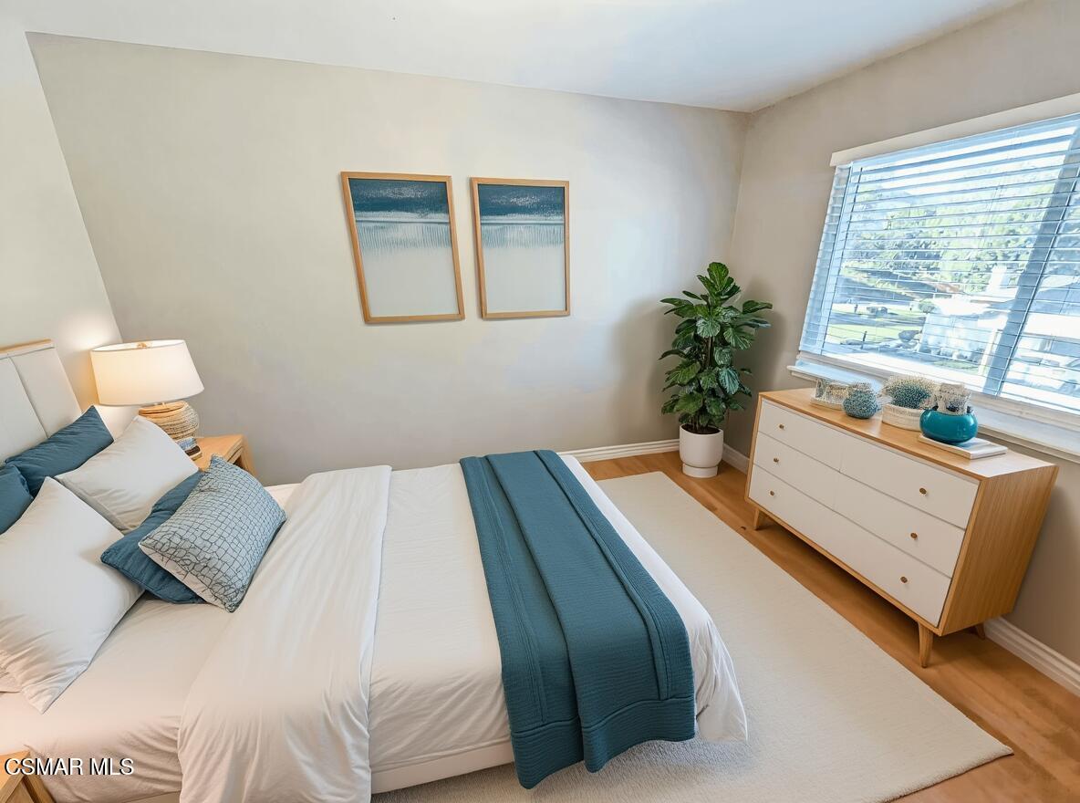 28713 Conejo View Drive Agoura Hills, CA 91301 - Photo 24 of 28 a bedroom with a bed and a window