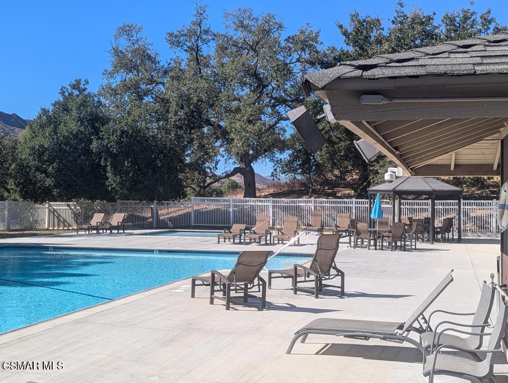 28713 Conejo View Drive Agoura Hills, CA 91301 - Photo 28 of 28 a view of a swimming pool with outdoor seating and yard