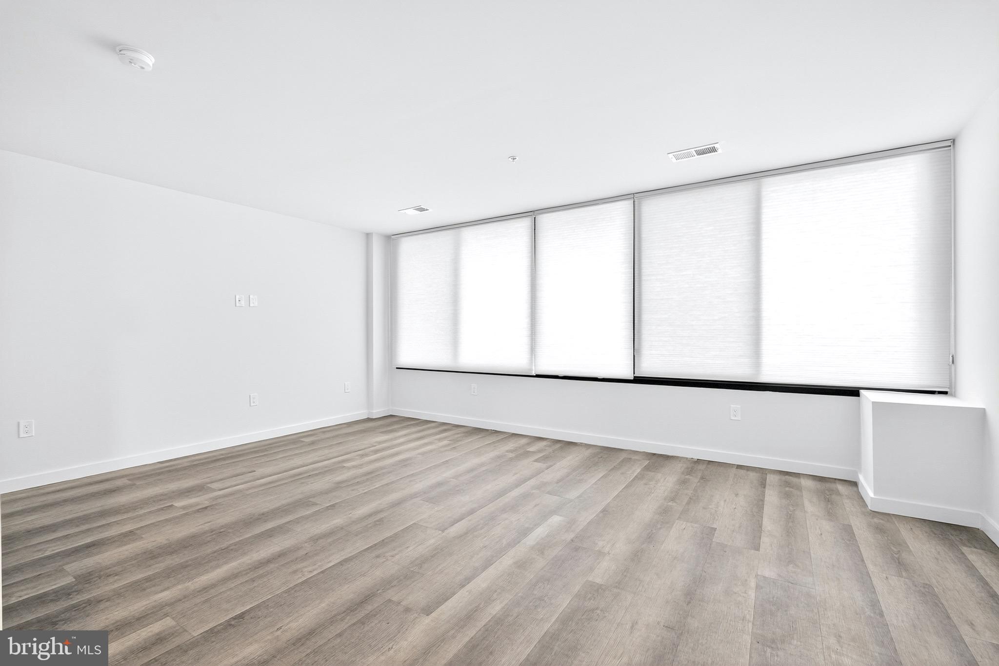 700 Roeder Road, Unit 104 Silver Spring, MD 20910 - Photo 4 of 15 Bright Living Area