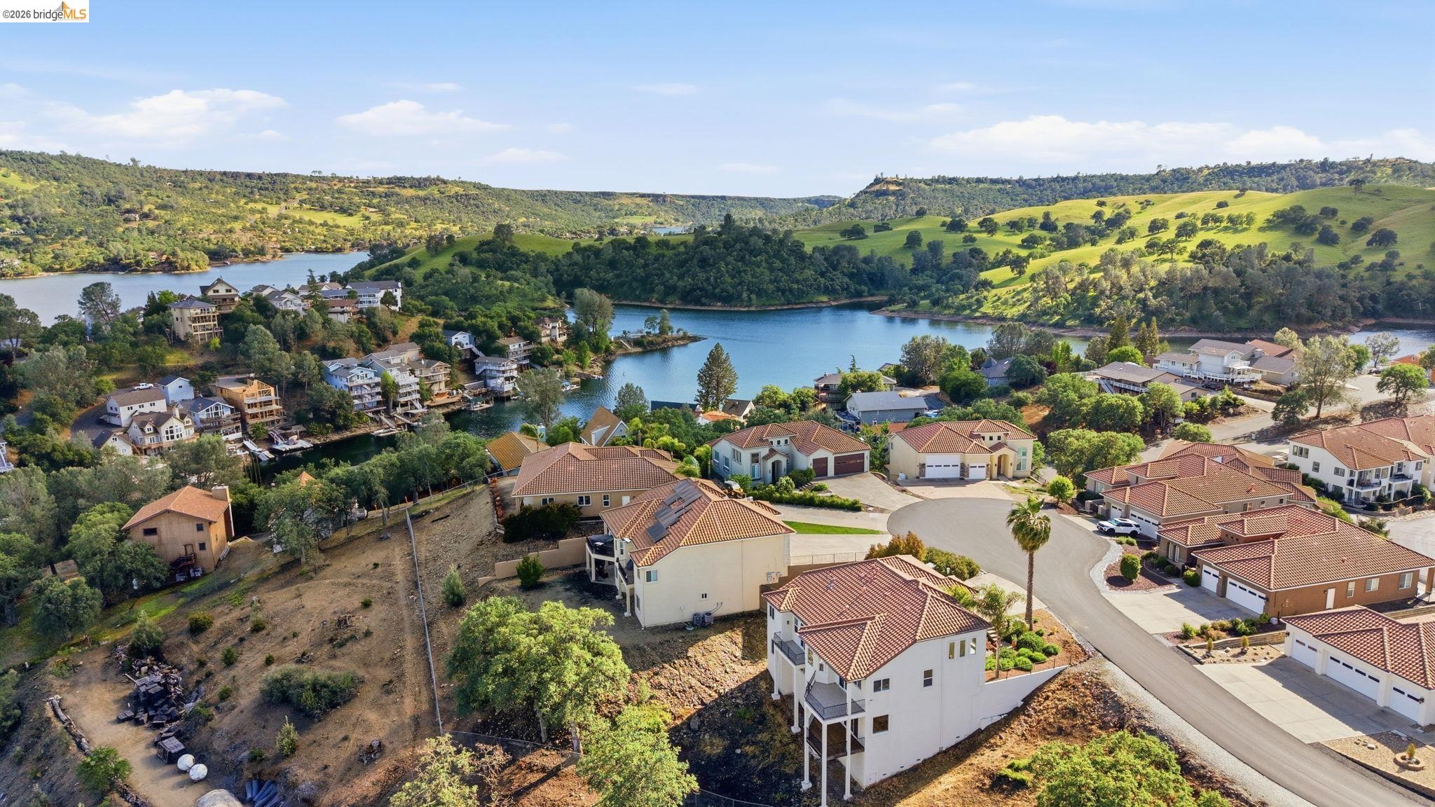 Aerial view of residential area with a large body of water