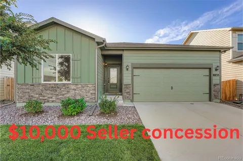 a front view of a house with garage