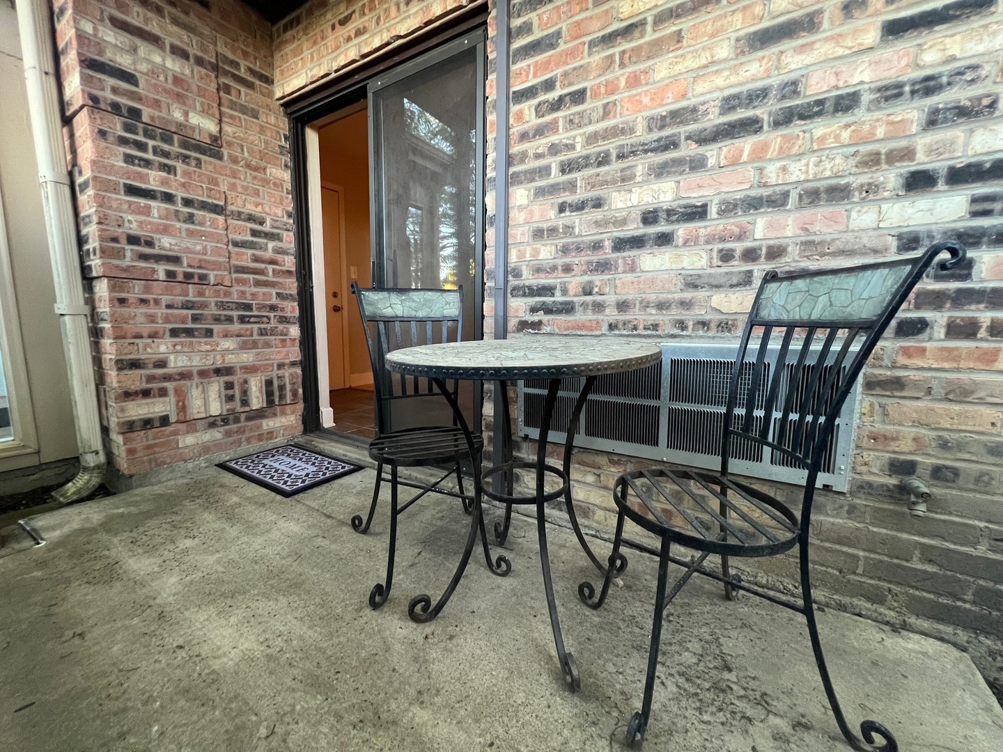 2219 Nichols Road, Unit 17A Arlington Heights, IL 60004 - Photo 13 of 19 a view of a dinning tables and chairs in the patio