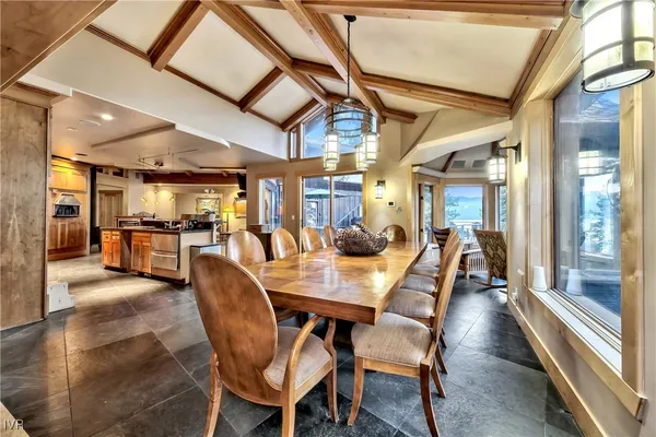 a dining room with furniture and wooden floor