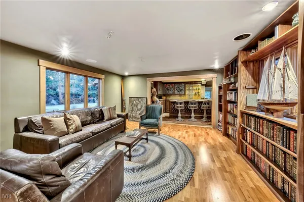 a bed sitting in a bedroom next to a balcony
